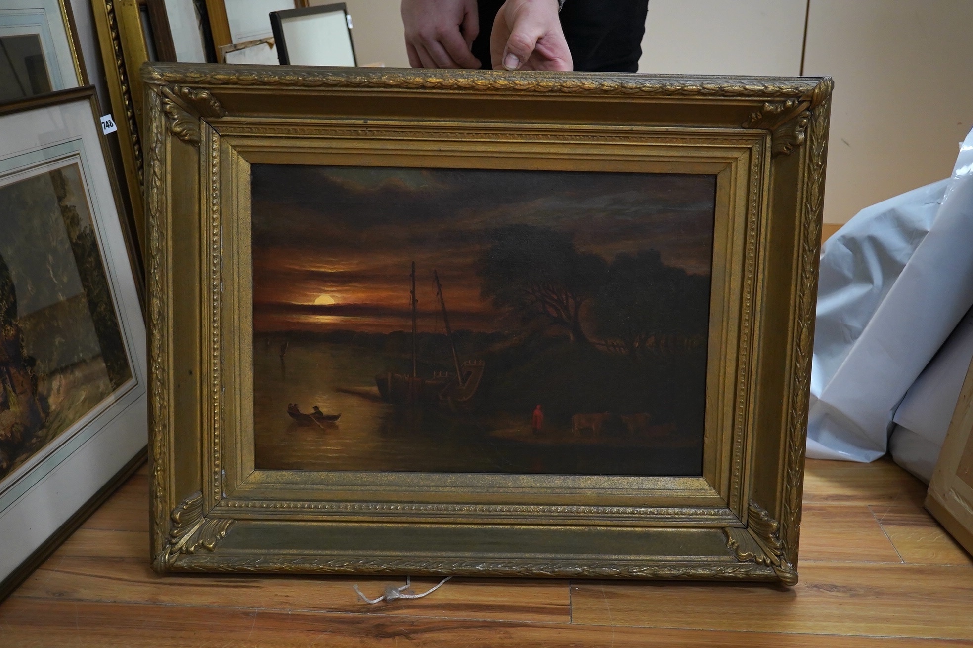 19th century, English School, oil on canvas, Moonlit riverscape with boats and figures, unsigned, 32 x 47cm, gilt framed. Condition - fair to good